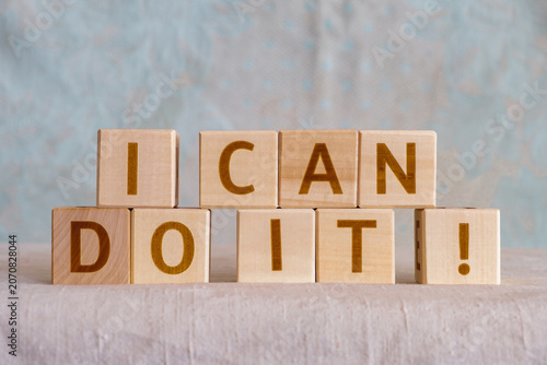 i can do it !, motivational phrase made of letters on wooden cubes