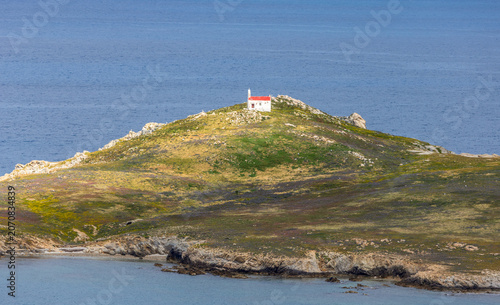 Photos Small old Orthodox Greek church on the rocky hill of the island of Mykonos, Gree