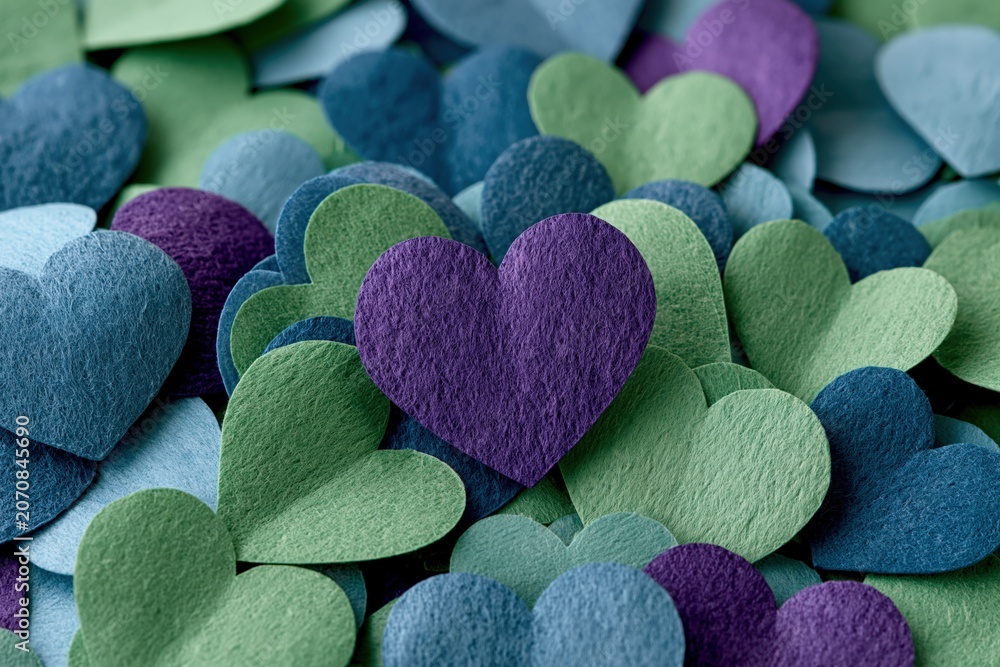 Obraz premium Paper heart shapes layered on textured surface macro view