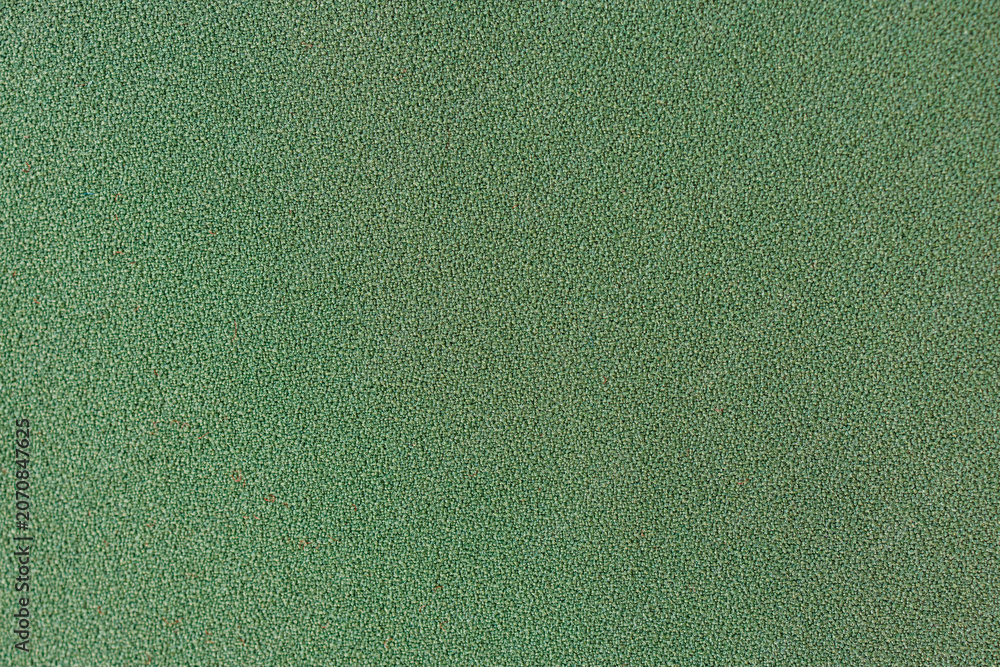 Fototapeta premium Green textile fabric texture background with fine woven surface