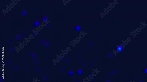 Night sky with bright blue stars and glowing lights