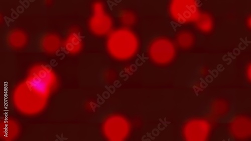 Red bokeh lights in a dark background with glow effect