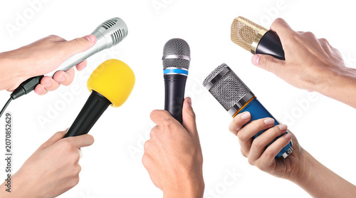 Fotografie People holding microphones in hands against transparent background, closeup