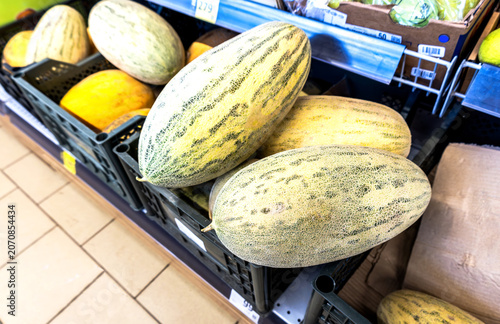 Fresh melons are sold at the grocery store