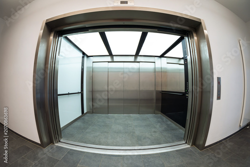 Φωτογραφία Modern freight elevator with open doors in fisheye perspective
