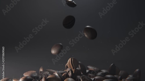 Entering roasted coffee beans rotating and colliding at low-angle studio close-up, raising dust