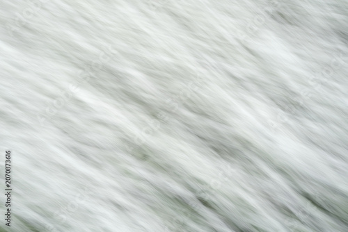 Soft, swirling textures move across the frame