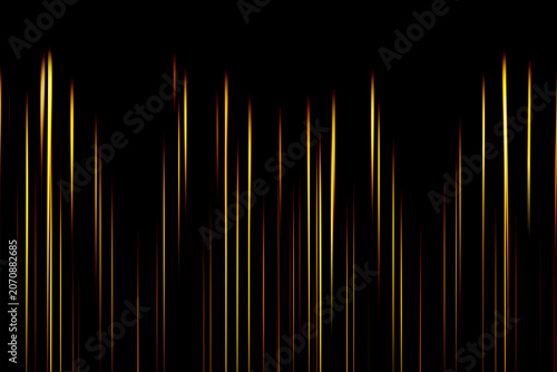 Abstract vertical glowing light streaks on black background. Golden, yellow and orange luminous lines create a futuristic technology pattern with elegant minimal design.