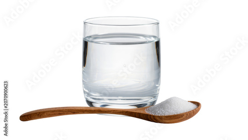Foto Isolated glass of pure drinking water and wooden spoon with white granulated sug