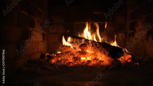 Warm Glowing Fire Burning Bright in Brick Fireplace
