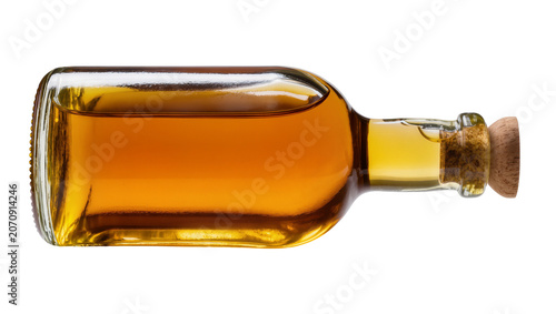 Fotografía Isolated small rectangular glass bottle of premium amber-colored liqueur with a