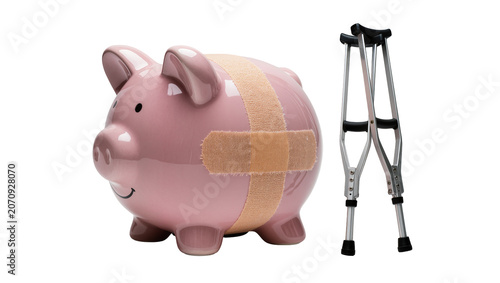 Canvastavla Isolated pink piggy bank with a band-aid and crutches representing medical financial hardship