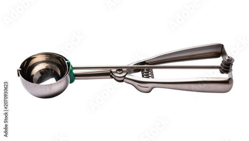 Canvastavla Isolated stainless steel ice cream scoop with a green handle for serving frozen