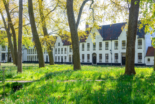 Beguinage (Begijnhof) courtyard in Bruges old town, Belgium