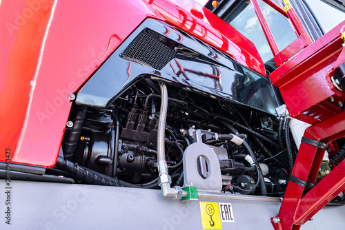 Canvastavla Low-angle close view of a heavy truck's open engine compartment showing exposed