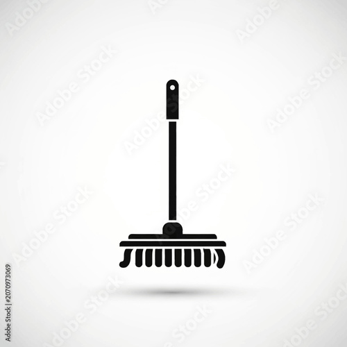 Broom with long handle and bristles.