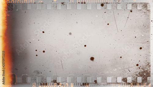 Vintage 35mm film frame overlay with light leak and dust texture. Distressed retro analog photography effect with