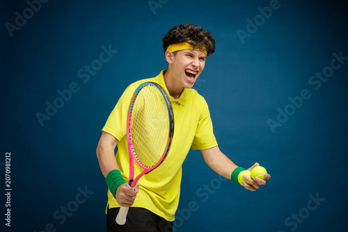 Fotografía Cheerful Young Tennis Player Celebrating Victory with Racket and Balls