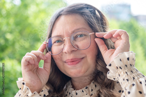Konstfotografi Mature woman 50 years old wearing glasses, poor vision, myopia problem, optical