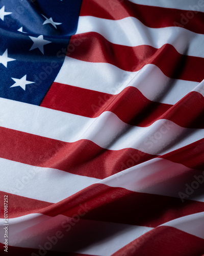 Patriotic waving american flag with stars and stripes closeup