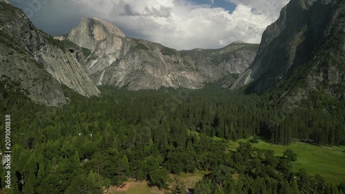 Yosemite Valley showcasing dramatic granite cliffs, lush forests, and winding river under natural daylight in California’s Sierra Nevada.	
