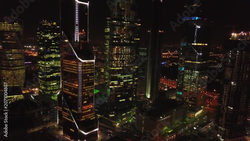 Night drone orbit over Moscow City towers