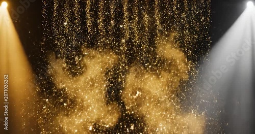 Golden glitter falling like rain on stage with spotlights