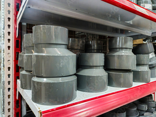 Принти на полотні Gray uPVC reducer socket fittings in various sizes displayed on store shelves