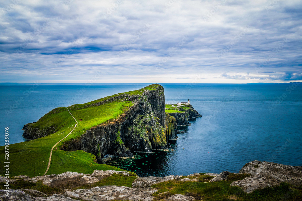 Naklejka premium The Neist Point Lighthouse, located on the most westerly point of the Isle of Skye in Scotland