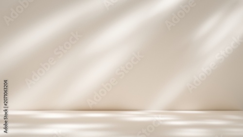 Fotografija Minimalist beige studio background with natural window shadow overlay for produc