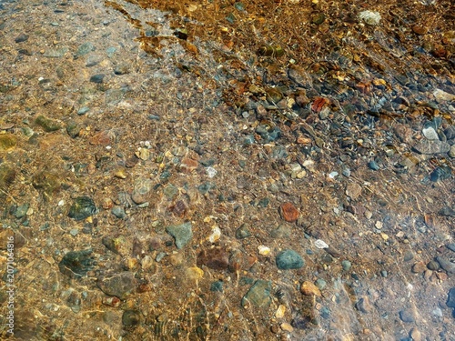 texture of the stone, Clear river water over stones.