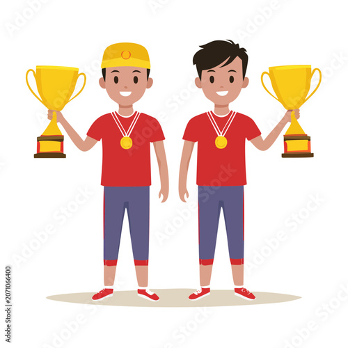 Two happy boys holding golden trophies and wearing medals