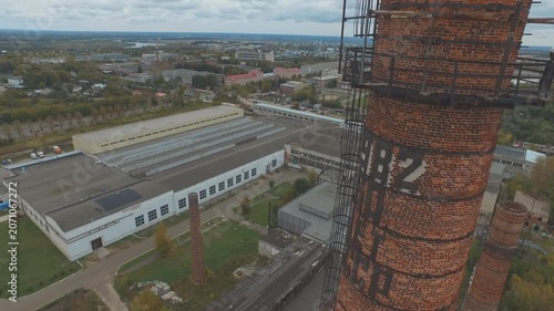 Drone ascending vertically over chimney