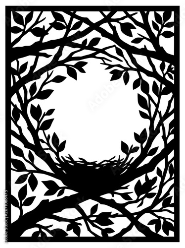 silhouette of a bird nest in tree branches with leafy circular frame