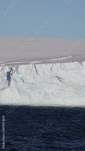 Rough Textured Close-Up of an Antarctic Glacier Ice Wall Showing Deep Blue Crevasses and Fractured White Ice