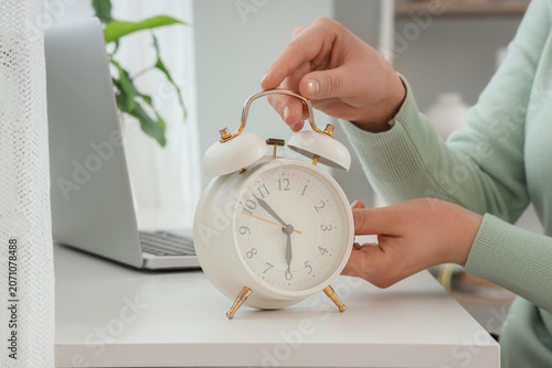 Female hands setting time o...