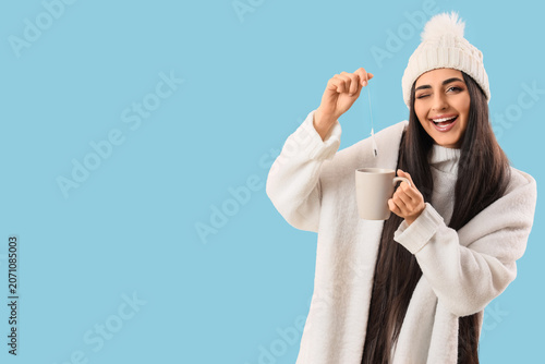 Happy young woman in winter...
