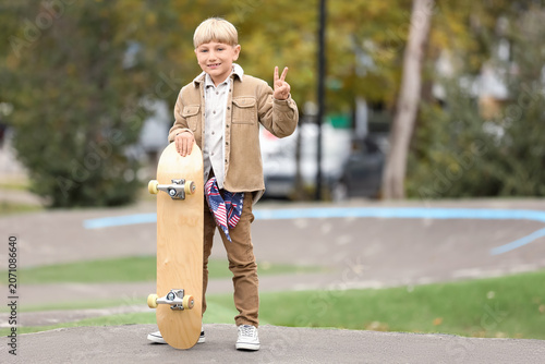 Cute little boy with skateb...