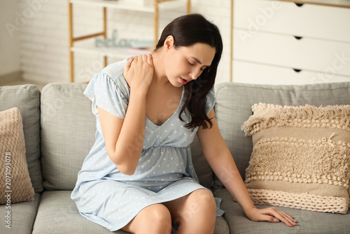 Young pregnant woman suffer...