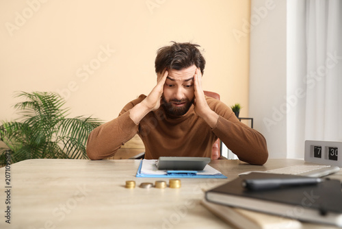 Stressed businessman workin...