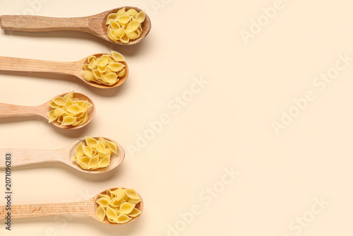 Wooden spoons with raw past...