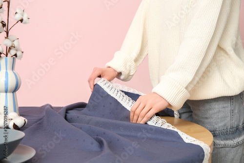 Young woman laying blue tab...
