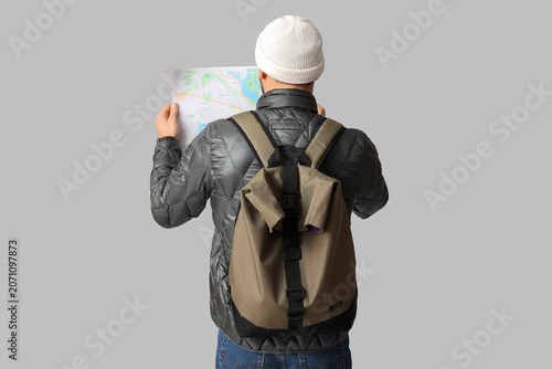 Young male tourist with bac...