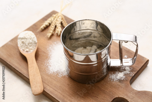 Metal sieve mug with flour,...