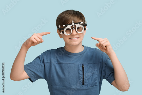 Little boy pointing at opti...