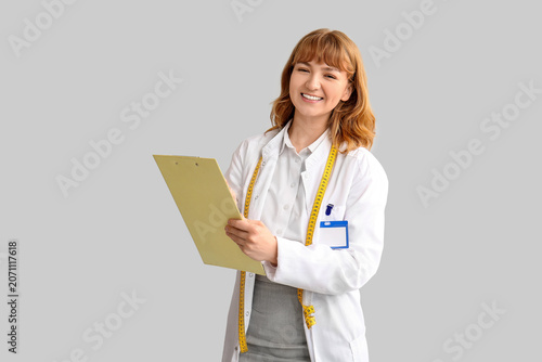 Young happy female nutritio...