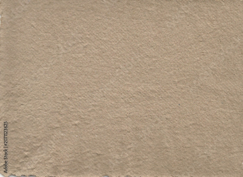 warm beige kraft paper texture with realistic recycled fiber details, natural matte finish, subtle grain, and handcrafted appearance. Perfect as an eco-friendly background for packaging
