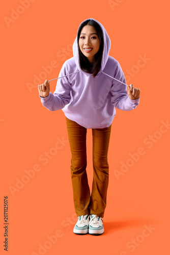 Young Asian woman in lilac ...