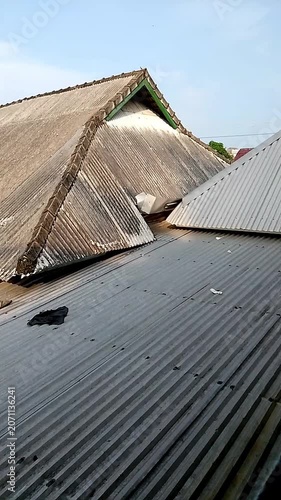 Short video of asbestos roofing in Indonesian government housing.