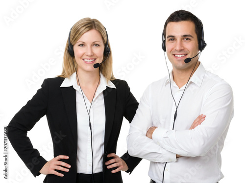 Professional call center operators wearing headsets, smiling customer service representatives in business attire, friendly telemarketing team on white background